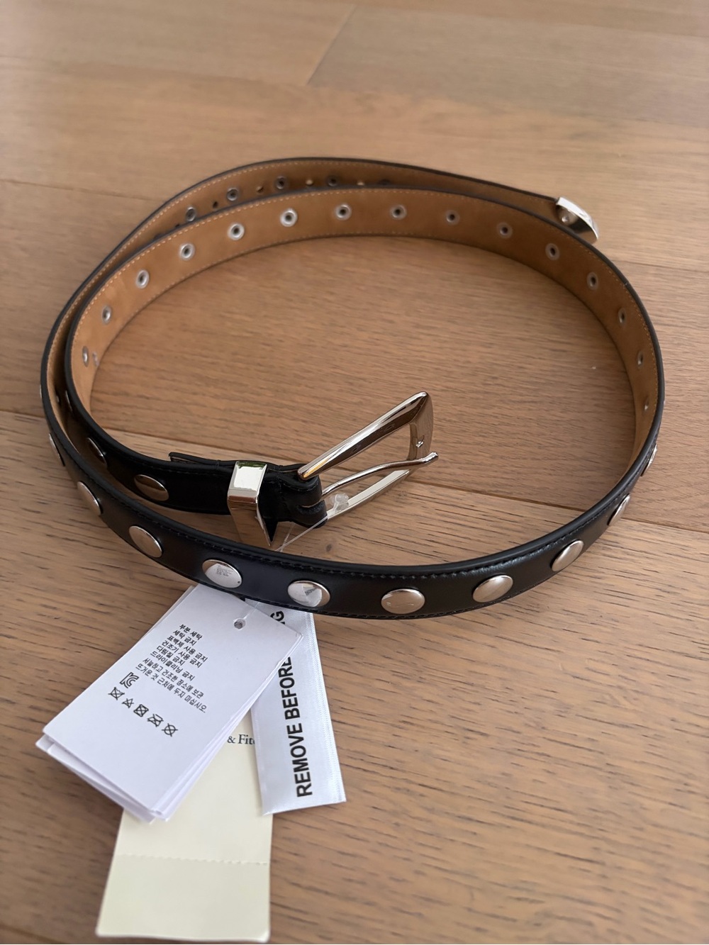 Black leather belt with silver studs